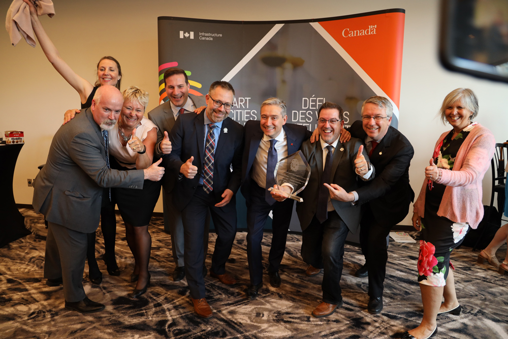 Guelph-Wellington team celebrating their win with Minister Champagne  