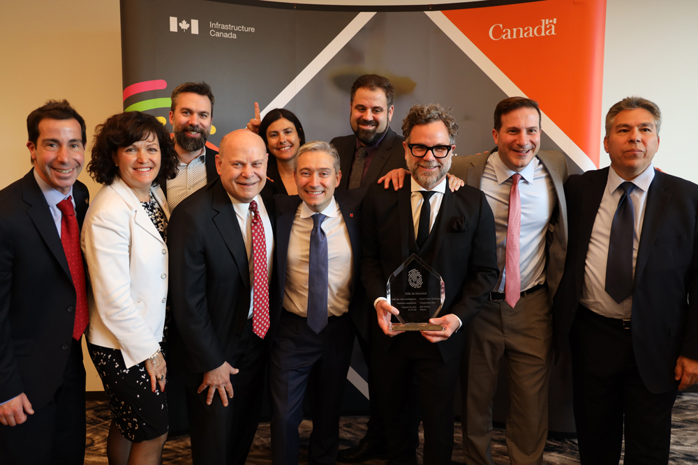 City of Montreal team celebrating their win with Minister Champagne 