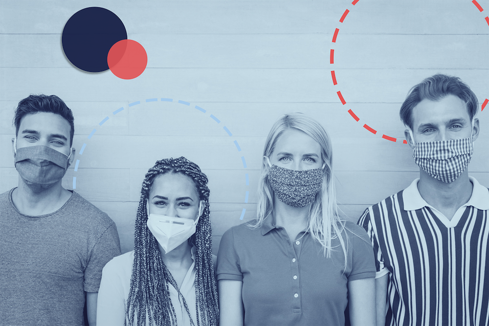 group of masked people standing against a wall 