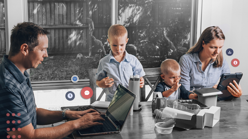 Family working from home at the dinner table 