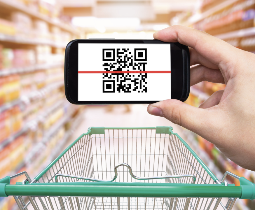 Cellphone displaying QR code above a shopping cart, in a store 