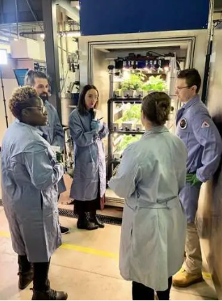 Members of the Canadian Space Agency panel speak with U of G team members Rosemary Brockett and Jared Stoochnoff in front of the GOOSE chamber 
